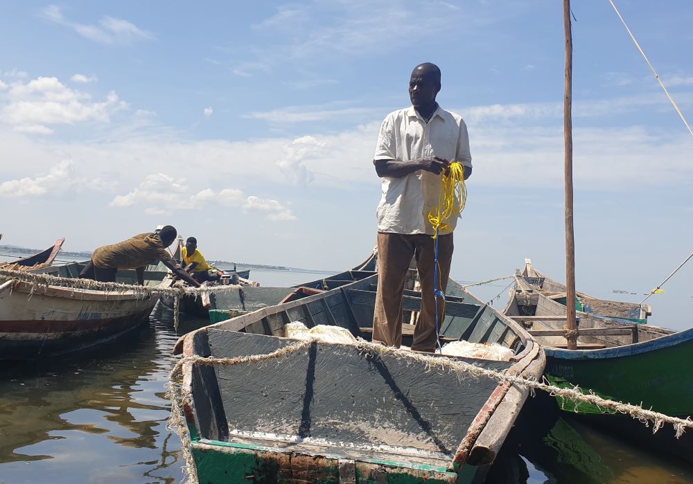 A fisherman spreads his net at the shores of Lake Victoria Jan. 26, 2022.