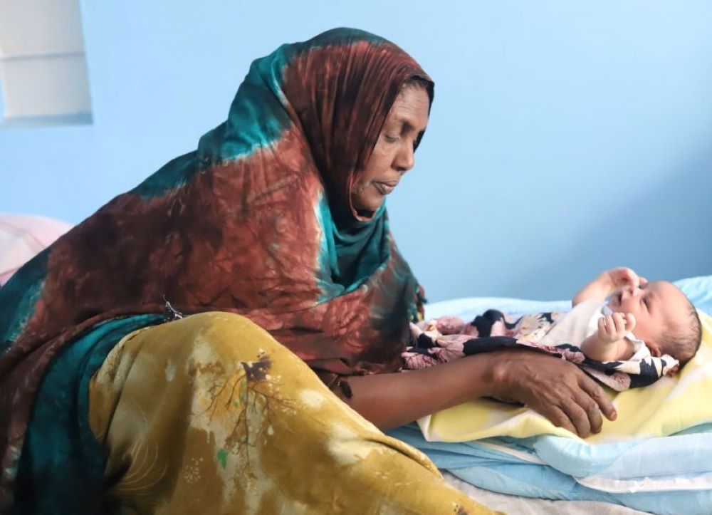 A woman tends to a newborn at the Kakuma Mission Hospital in Kakuma, a town in northwest Kenya. (GSR photo/Doreen Ajiambo)