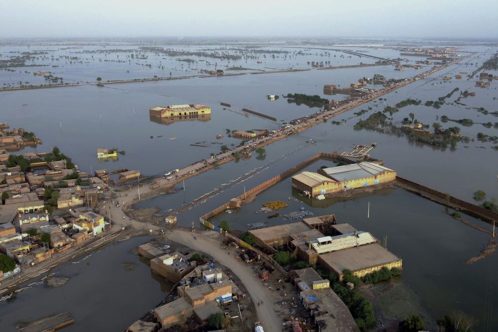 Homes are surrounded by floodwaters in Sohbat Pur city, a district of Pakistan’s southwestern Baluchistan province, Aug. 29, 2022. Disaster officials said nearly a half million people in Pakistan were crowded into camps after losing their homes in widespread flooding caused by unprecedented monsoon rains. (AP Photo/Zahid Hussain)