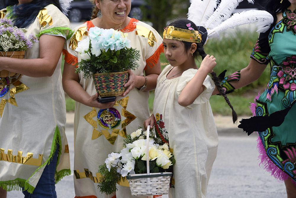 Members of Cristo Rey Parish prepare before the Parliament of the World's Religions Parade of Faiths on Sunday, Aug. 13, in Chicago. (AP/Paul Beaty)