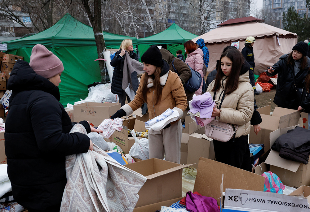 Humanitarian aid is delivered Jan. 16 after an apartment block was heavily damaged by a Russian missile strike in Dnipro, Ukraine. (OSV News/Reuters/Clodagh Kilcoyne)