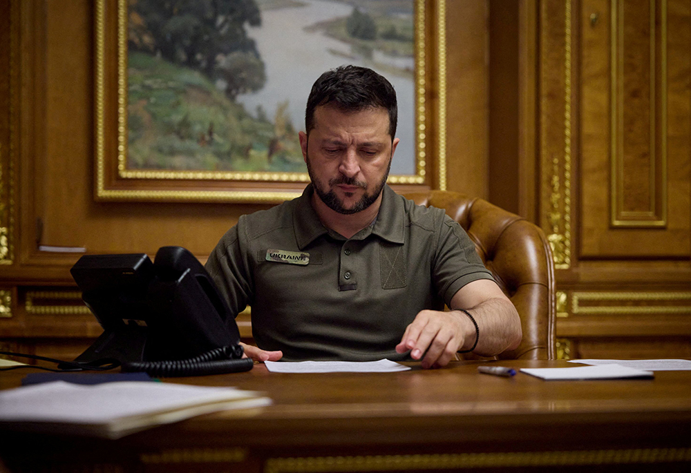 Ukraine's President Volodymyr Zelenskyy discusses a restoration of the Black Sea Grain Initiative with Turkish President Recep Tayyip Erdogan via a phone line in Kyiv in this file photo from July 27. (OSV News//Handout via Reuters/Ukrainian Presidential Press Service)