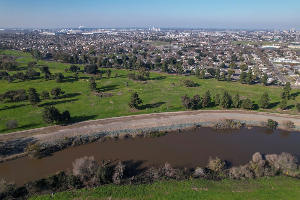 The Walker Slough, an offshoot of the San Joaquin River, is seen running alongside Van Buskirk Park in Stockton, Calif., Jan 26, 2023. Environmental groups hope the former municipal golf course will be converted into a restored floodplain. (OSV News/Reuters/Nathan Frandino)