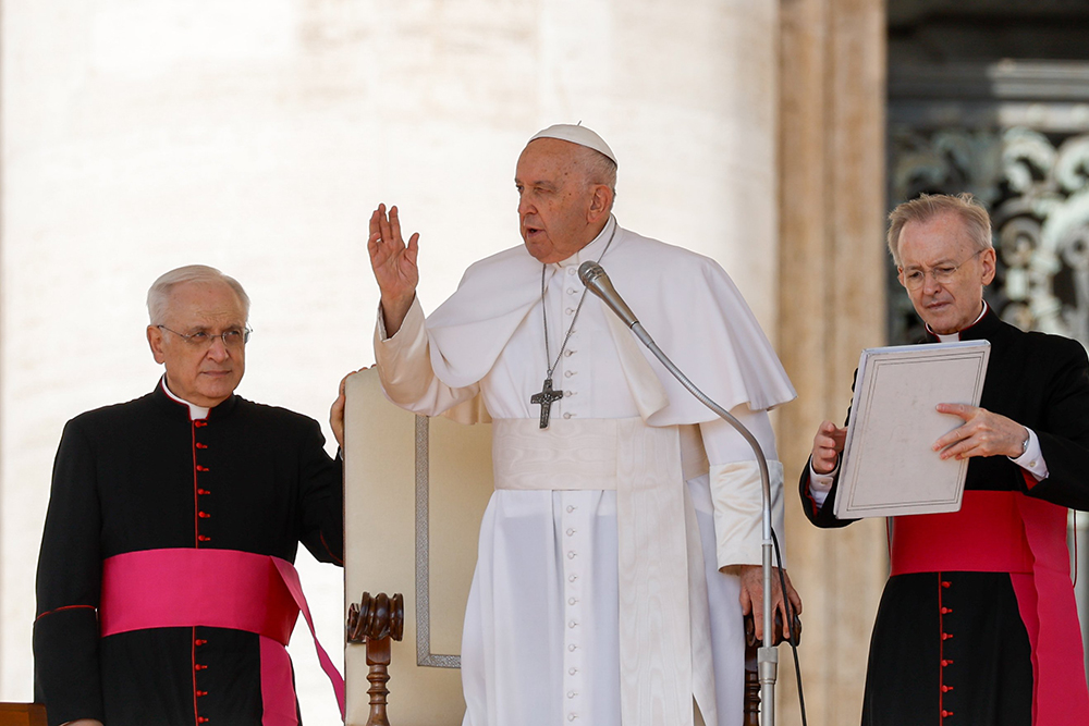 Pope Francis gives his blessing at the end of his weekly general audience in St. Peter’s Square at the Vatican Sept. 27. (CNS/Lola Gomez)