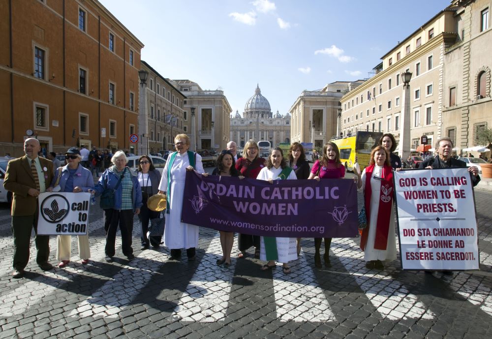 Group protests near Vatican, They carry signs supporting women's ordination,