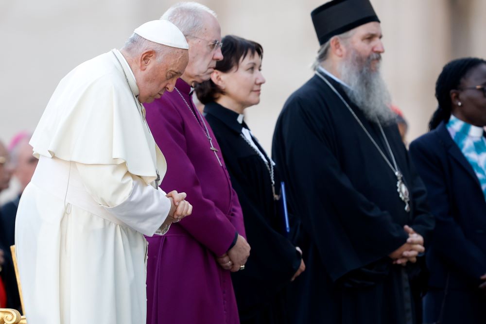 Pope Francis, Anglican Archbishop Justin Welby of Canterbury and the Rev. Ann Burghardt, general secretary of the Lutheran World Federation, join other Christian representatives for an ecumenical prayer vigil in St. Peter's Square Sept. 30, ahead of the assembly of the Synod of Bishops. (CNS/Lola Gomez)