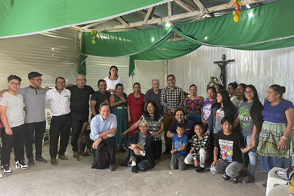 Members of a delegation of faith leaders from five countries gather with parishioners after Mass at the Chapel of Santa Anita in Chinautla, Guatemala, in mid-August. (Courtesy of Faith in Action)