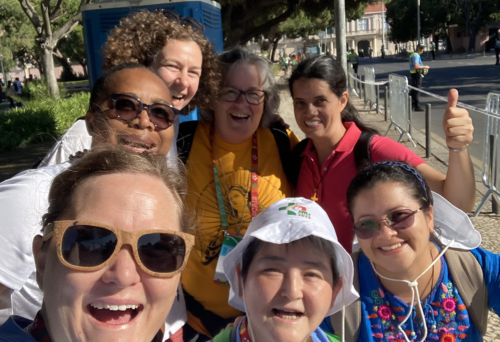 Sisters of the Congregation of Notre Dame de Montreal take a photo after seeing Pope Francis drive by moments earlier during World Youth Day. Pictured in the back row are Srs. Christa Gesztesi, Sue Kidd and Sofia Barrientos Izaguirre; Sr. Sophie Christine Mbougoum in the middle; and in the front are Srs. Libby Osgood, Motoko Takahashi, Idalia Nieto. (Courtesy of Libby Osgood)