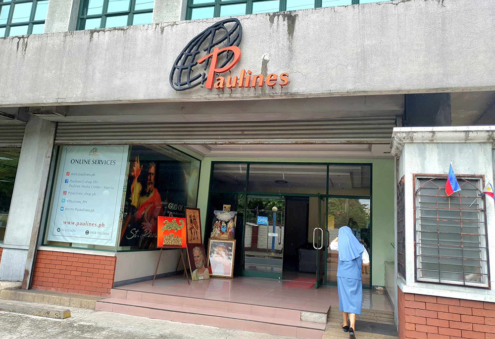 Pauline Sr. Pinky B. Barrientos crosses the street from the congregation's central house to the provincial house and communication center building. (GSR photo/Oliver Samson)