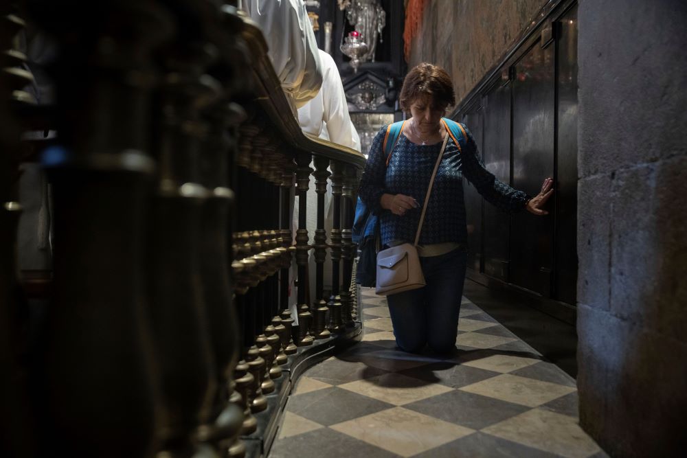 A woman walks on her knees at the Jasna Gora Monastery, Poland's most revered Catholic shrine, in Czestochowa, Poland, Sept. 23. (AP/Michal Dyjuk)