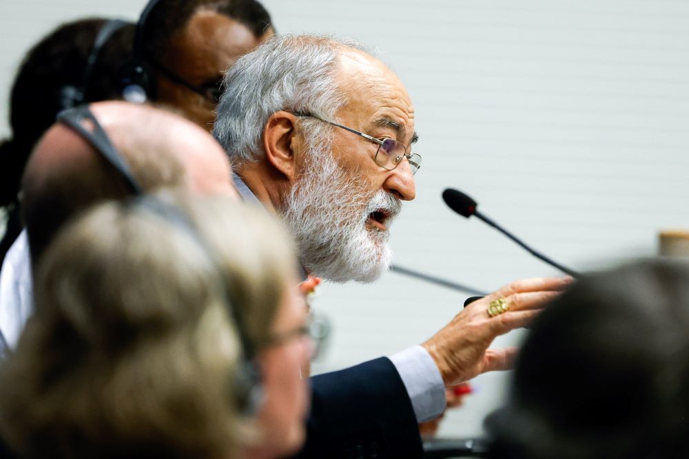 Cardinal Cristóbal López Romero speaks into mic.