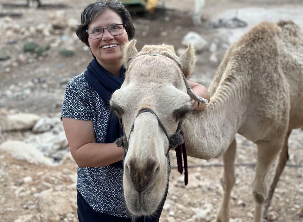Sr. Julia Hurtado is seen with a camel 