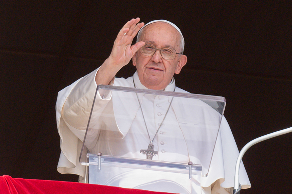 Pope Francis greets visitors gathered in St. Peter's Square at the Vatican to pray the Angelus Oct. 15. (CNS/Vatican Media)