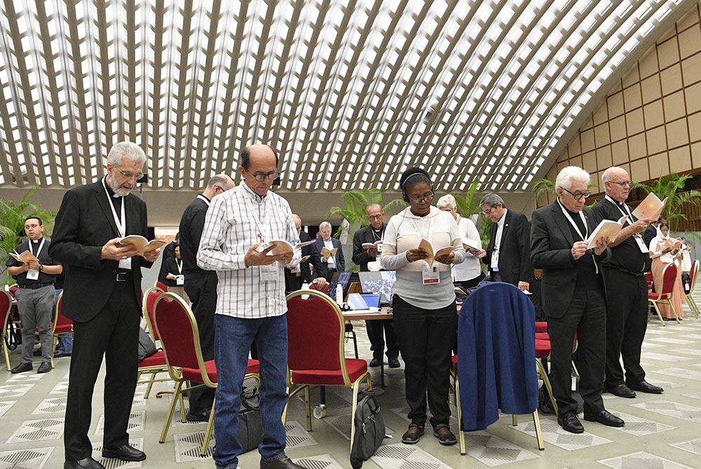 Members of the assembly of the Synod of Bishops gather for morning prayer Oct. 27 in the Paul VI Audience Hall at the Vatican. (CNS/Vatican Media)