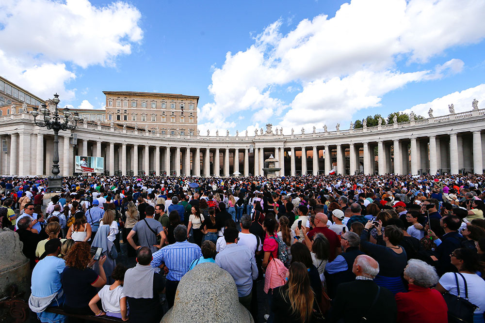 Visitors gather in St. Peter's Square at the Vatican to pray the Angelus with Pope Francis Oct. 29. (CNS/Lola Gomez)