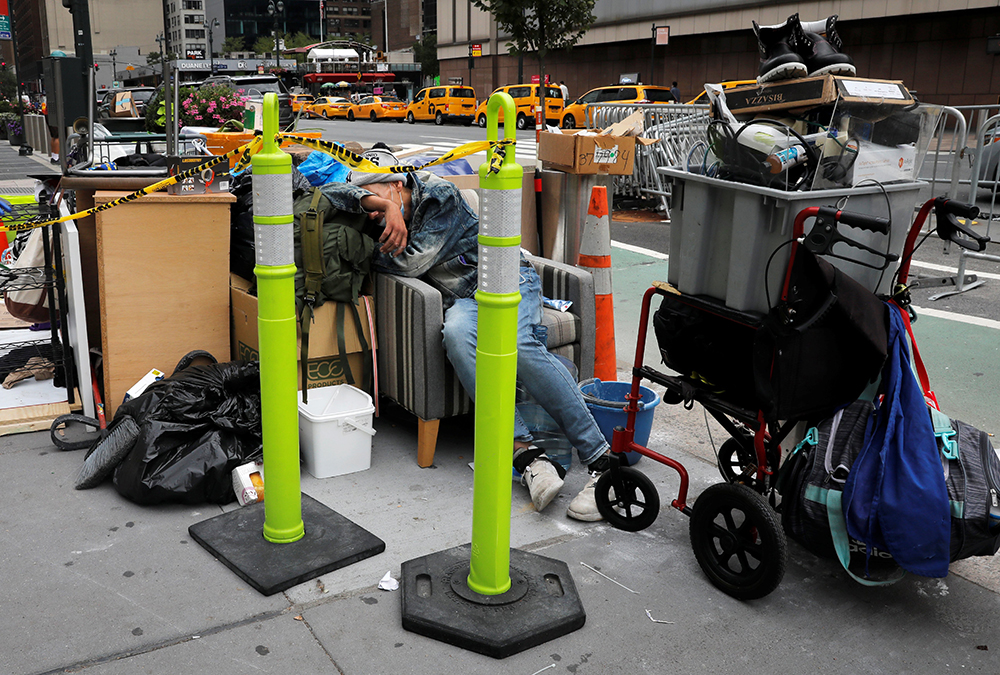 A homeless person in New York City sleeps among belongings Aug. 31, 2020. (CNS/Reuters/Mike Segar)