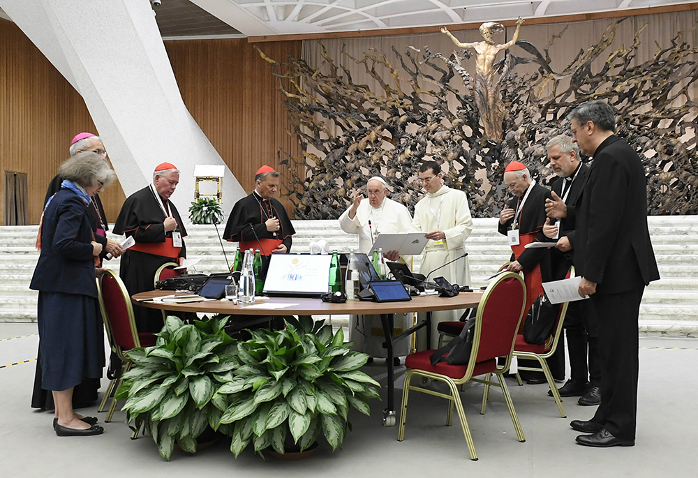 Pope Francis gives his blessing at the conclusion of the assembly of the Synod of Bishops' last working session Oct. 28, 2023, in the Paul VI Hall at the Vatican. (CNS/Vatican Media)