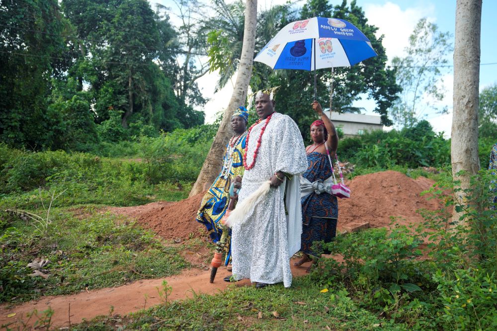 His Majesty Oviga Toffon, king of the Adjarra region, attends a meeting at the Oro sacred forest in Benin, on Wednesday, Oct. 4, 2023. “We don’t want any topographic or urbanization work that will destroy our forests and bring instability to our community,” and the divinities guarantee peace of mind and stability and shouldn’t be angered, he says. (AP/Sunday Alamba)