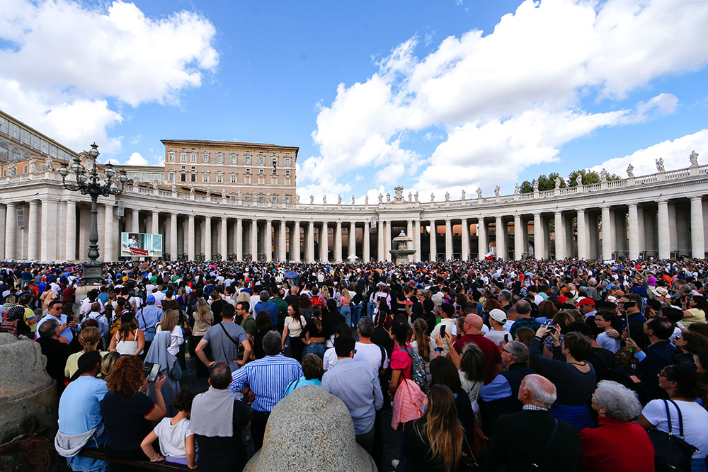 Visitors gather in St. Peter's Square at the Vatican to pray the Angelus with Pope Francis Oct. 29. (CNS/Lola Gomez)