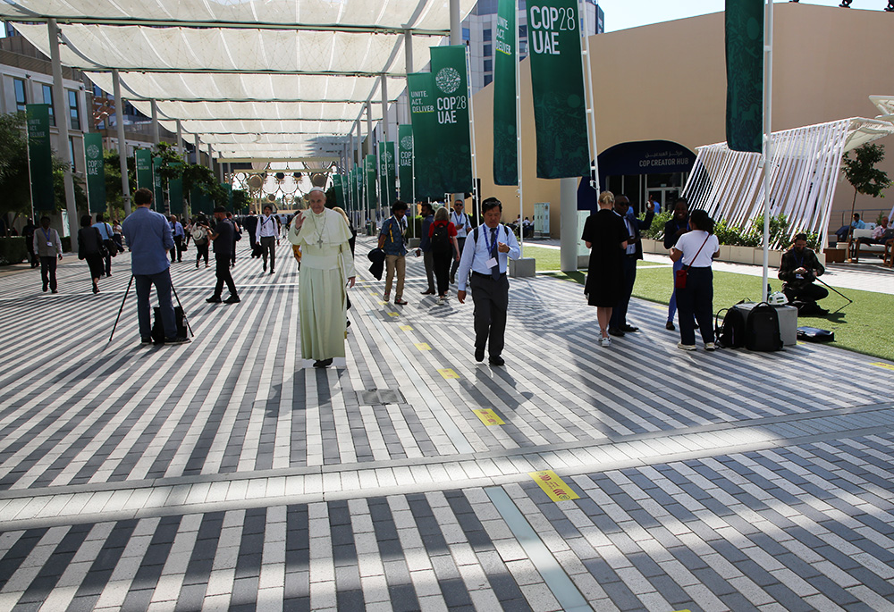 A cardboard cutout of Pope Francis stands in The Blue Zone near the Global Climate Action section at COP28 in Dubai, United Arab Emirates, Dec. 9. (Courtesy of Catholic Relief Services)