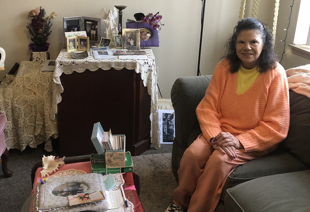 Sharon Browning sits in her Portland apartment this fall prior to attending a faith sharing group. After living on the streets and grappling with bipolar disorder and alcohol, Browning, now 64, found long-term stability in Catholic Charities-run permanent supportive housing. (NCR photo/Katie Collins Scott)