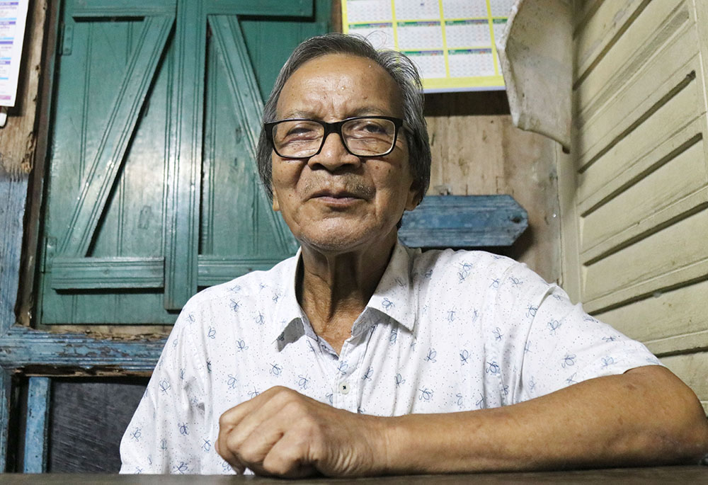 Utian Tongper, 71, head of Aliarchhara Punjee, is a nature worshiper. His father was also a nature worshiper who donated one acre of land to the sisters for education. (Stephan Uttom Rozario)