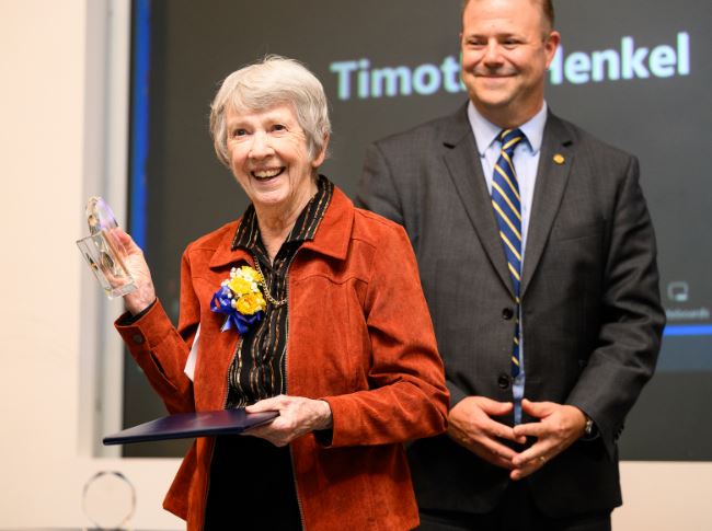 Adrian Dominican Sr. Beth Butler received the Honorary Alumni Award from Douglas Palmer, president of Siena Heights University in Adrian, Michigan, on Oct. 13, 2023, Butler directed the university's criminal justice department and taught classes there in the 1980s. (Courtesy of Laura Harvey/Siena Heights University)