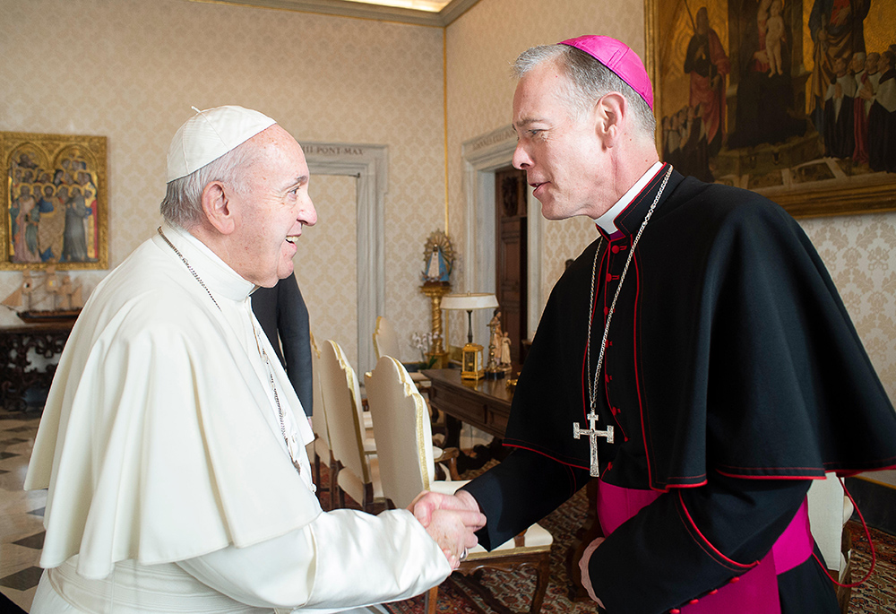 Pope Francis greets Archbishop Alexander Sample of Portland, Oregon, during a meeting with bishops from Washington, Oregon, Idaho, Montana and Alaska making their "ad limina" visits to the Vatican Feb. 3, 2020. (CNS/Vatican Media)