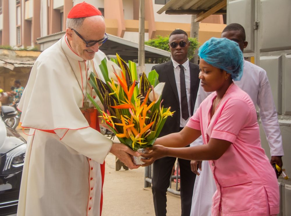 Cardinal Michael Czerny, prefect of the Dicastery for Promoting Integral Human Development, is greeted at the Saint Jean nonprofit health center in Cotonou, Benin, during his trip to the West African nation Jan. 17-20, 2024. During his visit to the health center Jan. 18, Cardinal Czerny met with the staff who provide much needed medical services for the people of the tiny African country neighboring Nigeria on the east, Togo and Burkina Faso on the west. (OSV News photo/courtesy Dicastery for Promoting Inte