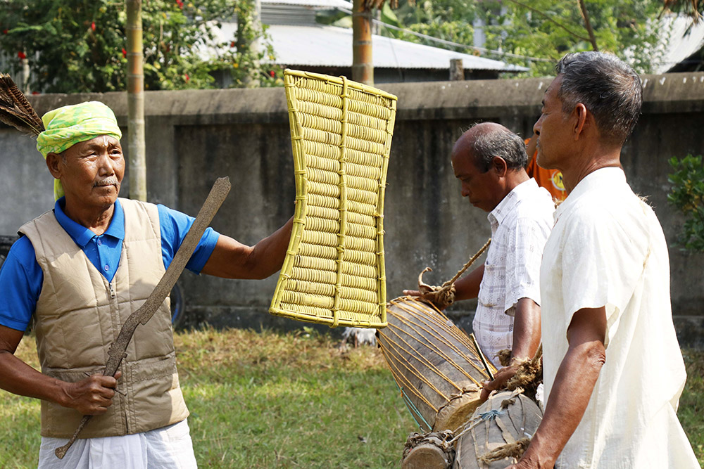 The Garo people handle their traditional objects so that the next generation can learn about the roots of the Garo. (Stephan Uttom Rozario)