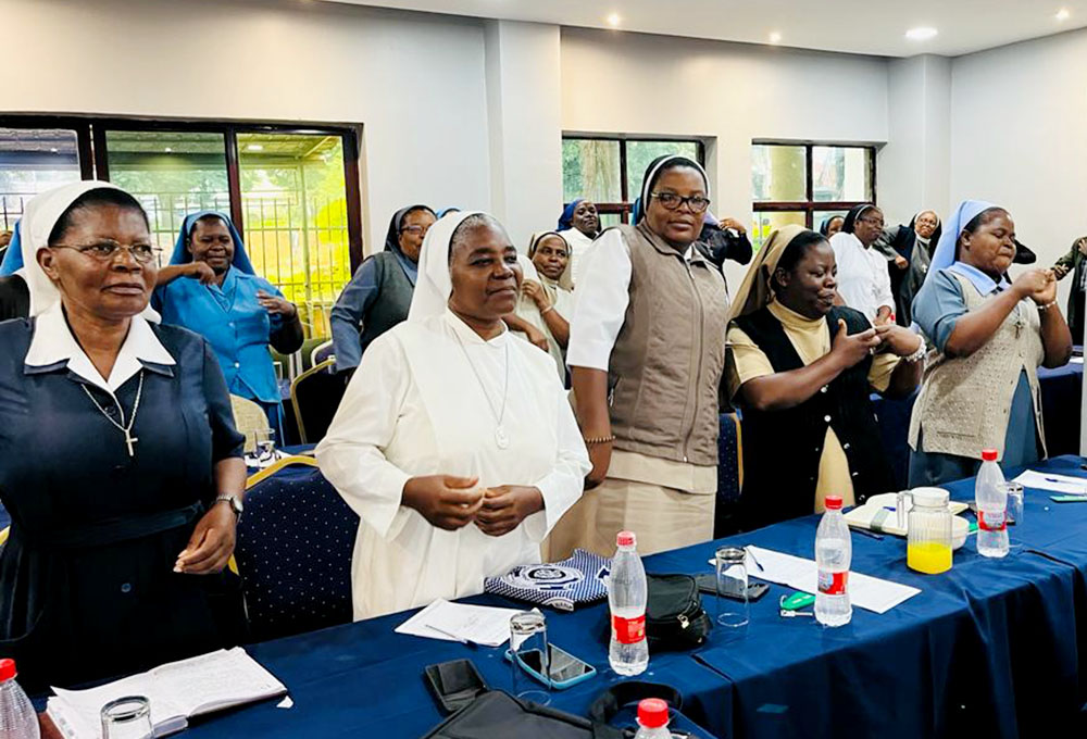 Religious sisters dance and exercise during an advocacy training in Lilongwe, Malawi's capital city, Jan. 17. The training was organized by the All-Africa Conference Sister to Sister and the Africa Faith and Justice Network to help sisters acquire skills to advocate for people affected by the cyclone that hit Malawi and other southern African countries in March 2023. (Eneless Chimbali)