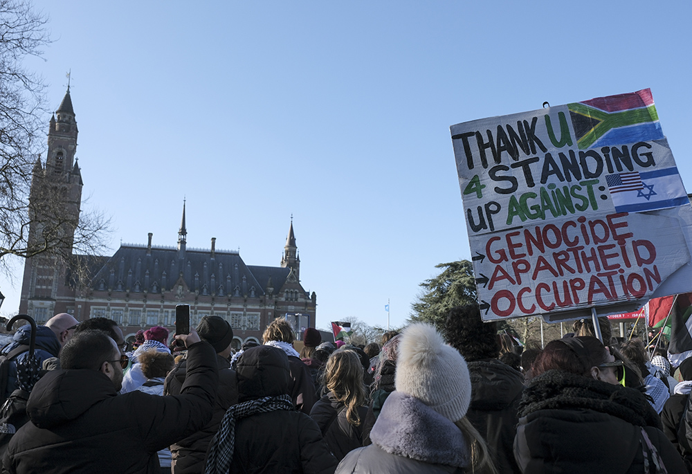 Pro-Palestinian activists gather near the International Court of Justice, or World Court, Jan. 26 in The Hague, Netherlands. The United Nations' top court has decided not to throw out genocide charges against Israel for its military offensive in Gaza. (AP photo/Patrick Post)