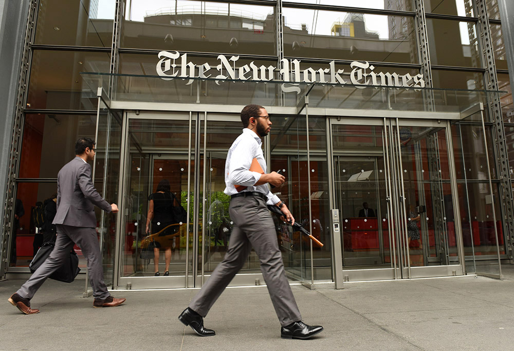 People are seen near the entrance of the New York Times building in New York City May 31, 2018. (Dreamstime/Bumbleedee)