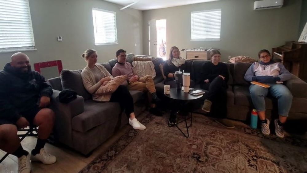 Catholic professionals, including teachers, gather for fellowship in the top story of a former convent in San Jose, California.