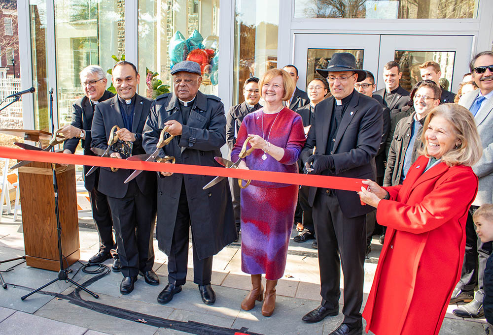 Washington Cardinal Wilton Gregory, center, participates in a ribbon-cutting ceremony Nov. 19, 2022, for the new Paulist House of Mission and Studies in Washington. Also pictured are Paulist Fr. Greg Apparcel, left, director of formation at the seminary; Paulist Fr. René Constanza, president of the Paulist Fathers; Deb Stype of Columbus, Ohio, representing Paulist donors; Paulist Fr. Eric Andrews, immediate past president of the Paulist Fathers and leader of the building project; and Francie Dix of Horsesho