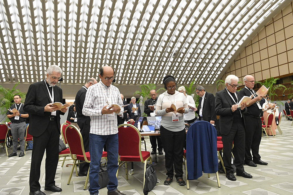 Members of the assembly of the Synod of Bishops gather for morning prayer Oct. 27, 2023, in the Paul VI Audience Hall at the Vatican. (CNS/Vatican Media)