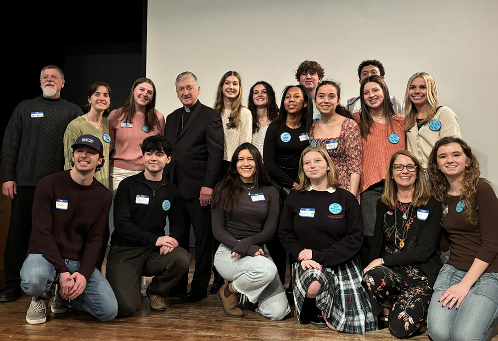 Members of the Catholic Youth Climate Summit leadership team pose for a photo with Cardinal Blase Cupich during the third annual gathering in Chicago, Feb. 25. (Courtesy of Catholic Climate Covenant)