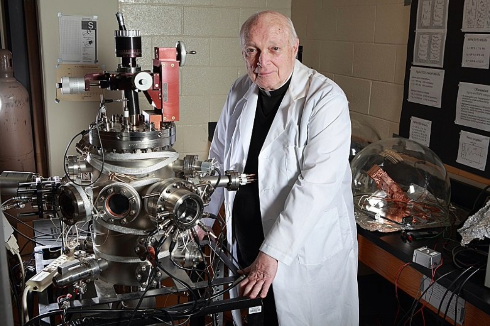 Portrait of Jesuit Fr. Frank Haig in laboratory. 