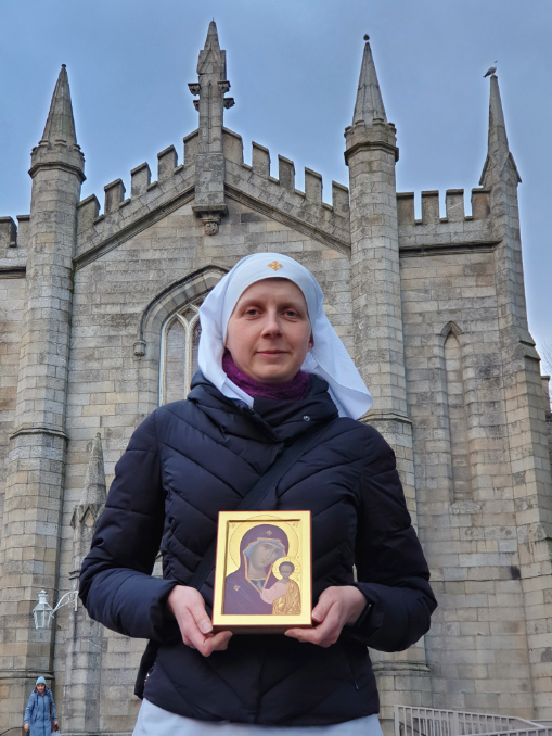 Sister Helen Volynets poses with an icon of Mary and the Christ Child outside Holy Apostles Peter and Paul Russian Orthodox Church in Harold's Cross in Dublin March 3, 2024.