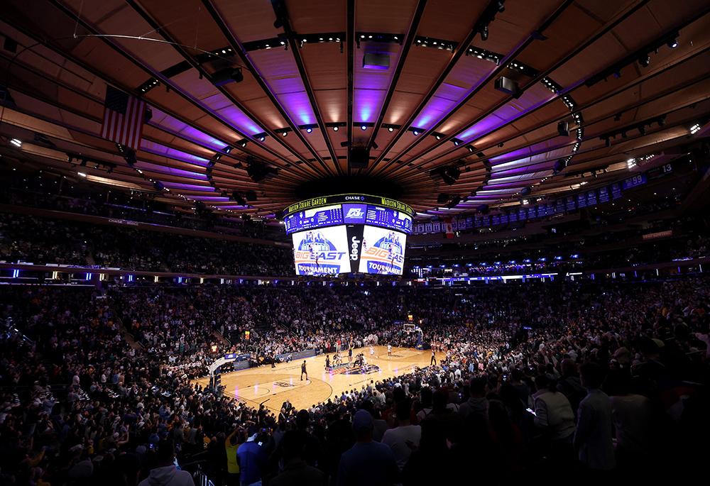 Players battle for the ball at the opening tip-off between the Marquette Golden Eagles and the Connecticut Huskies at Madison Square Garden March 16 in New York City. (OSV News/USA TODAY Sports via Reuters/Brad Penner)