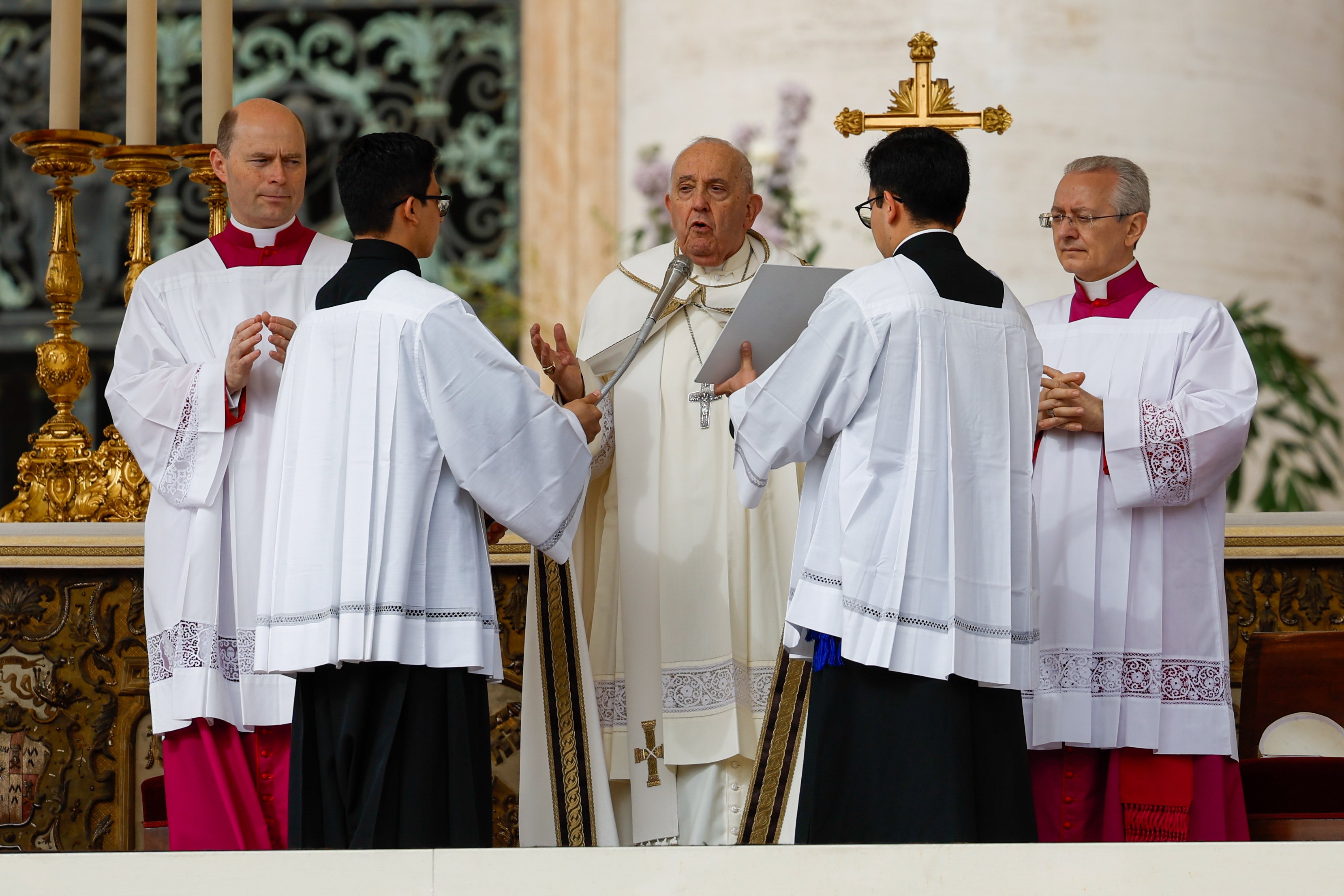 Pope Francis prays as he begins Easter morning Mass in St. Peter's Square at the Vatican March 31, 2024. (CNS photo/Lola Gomez)