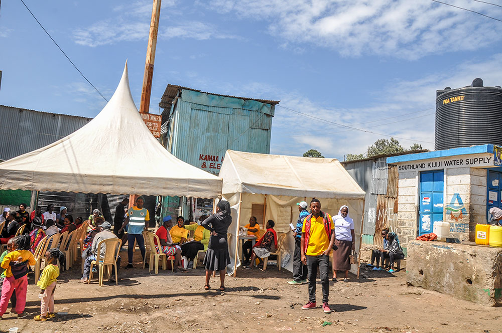 The DREAM Center pitched tents for medical outreach during World Aids Day in Southlands, Lang'ata, Nairobi, Kenya. Outreach includes tuberculosis screening; HIV testing; treatment for noncommunicable diseases like hypertension, diabetes and asthma; and screening for domestic violence. (Lourine Oluoch)