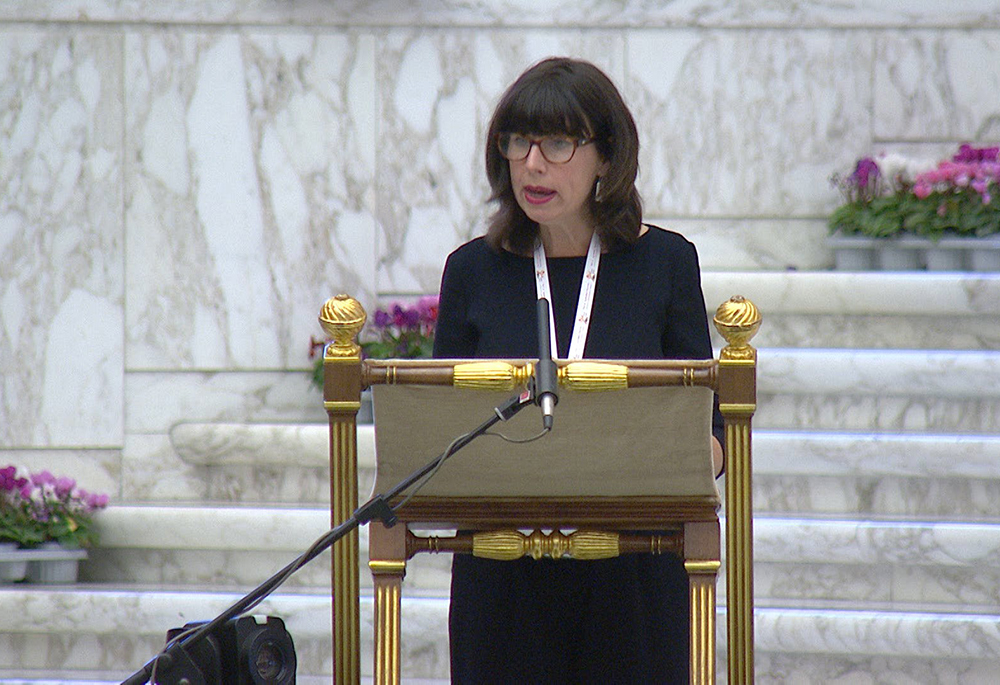 Anna Rowlands, a professor of Catholic social thought and practice at Durham University in England, gives a theological reflection as the assembly of the Synod of Bishops begins work on its section, communion, in this screengrab from Oct. 9, 2023, in the Vatican's Paul VI Audience Hall. (CNS/YouTube/Vatican Media)