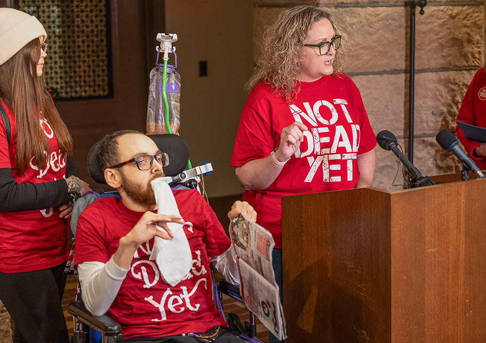 Kathy Ware, right, gives remarks about assisted suicide during a press conference Jan. 25 at the Minnesota Capitol ahead of a state House committee hearing about proposed legislation to legalize physician-assisted suicide in Minnesota. Next to her is her son, Kylen, who has quadriplegic cerebral palsy, epilepsy and autism. (OSV News/The Catholic Spirit/Dave Hrbacek)