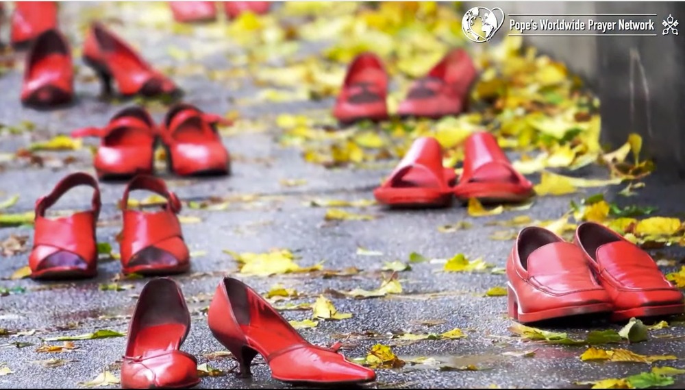 Red shoes, scattered along pavement, accented by yellow, fall leaves