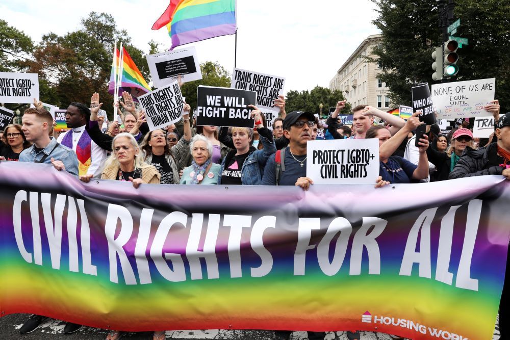 LGBTQ activists and supporters block the street outside the U.S. Supreme Court Oct. 8, 2019, as it hears arguments in a major case on workplace discrimination and gay and transgender employees. 