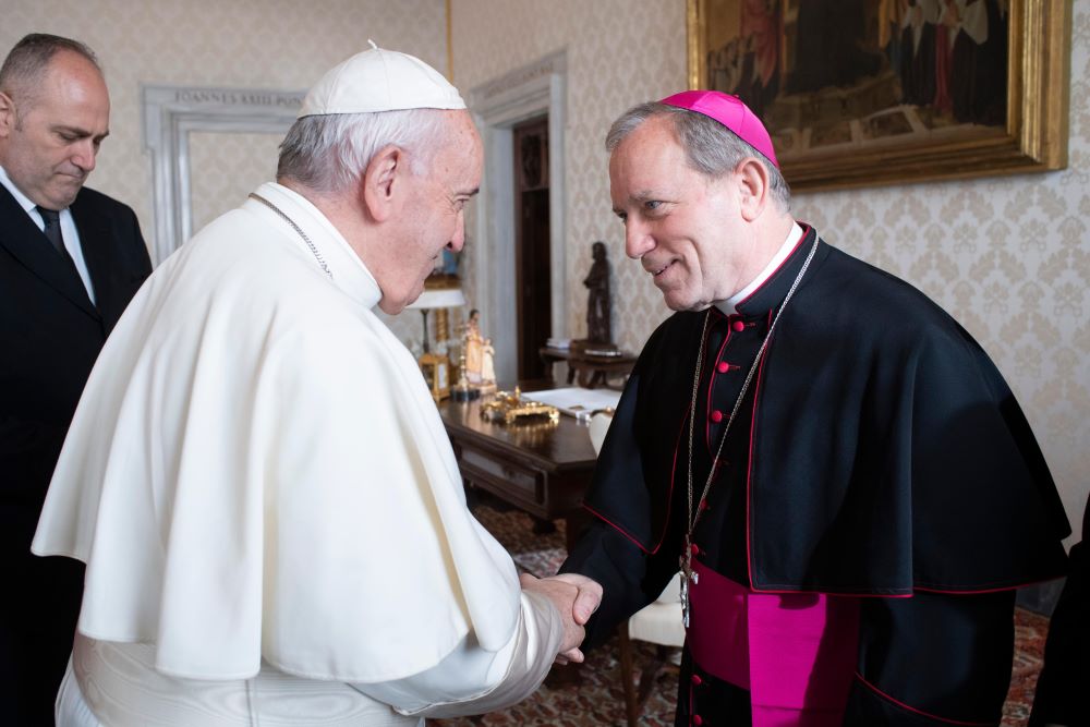 Pope Francis greets Bishop Robert Gruss of Saginaw, Mich., during a meeting with U.S. bishops from Ohio and Michigan making their "ad limina" visits to the Vatican Dec. 10, 2019.
