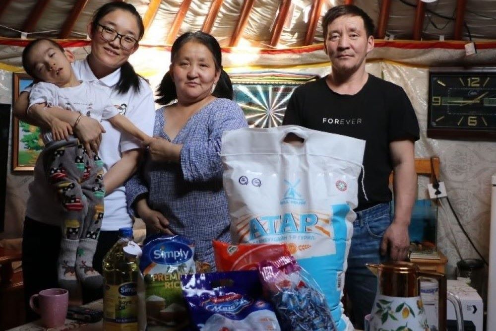 Sr. Magdalena visits a family.