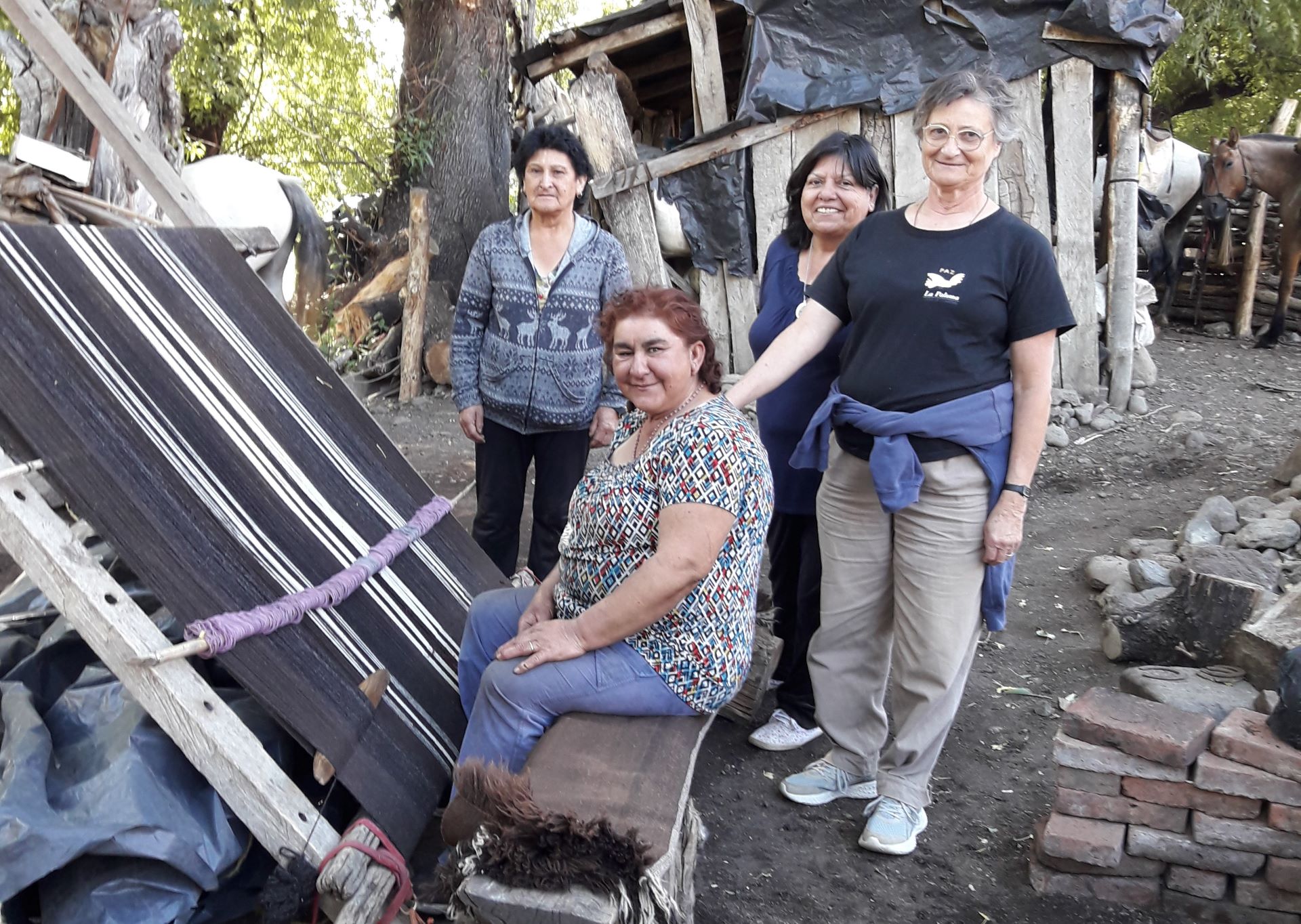 In the Argentinean mountain range of Neuquén, nomadic women weave the clothes their families will need. In the picture, some of them accompany Sr. Ana María Siufi, on the right. (Ana María Siufi)