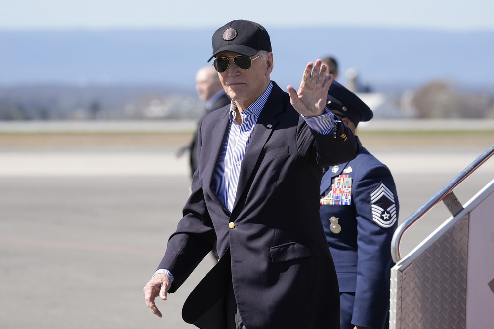 President Biden, Air Force One. President Biden waves as he departs presidential plane.